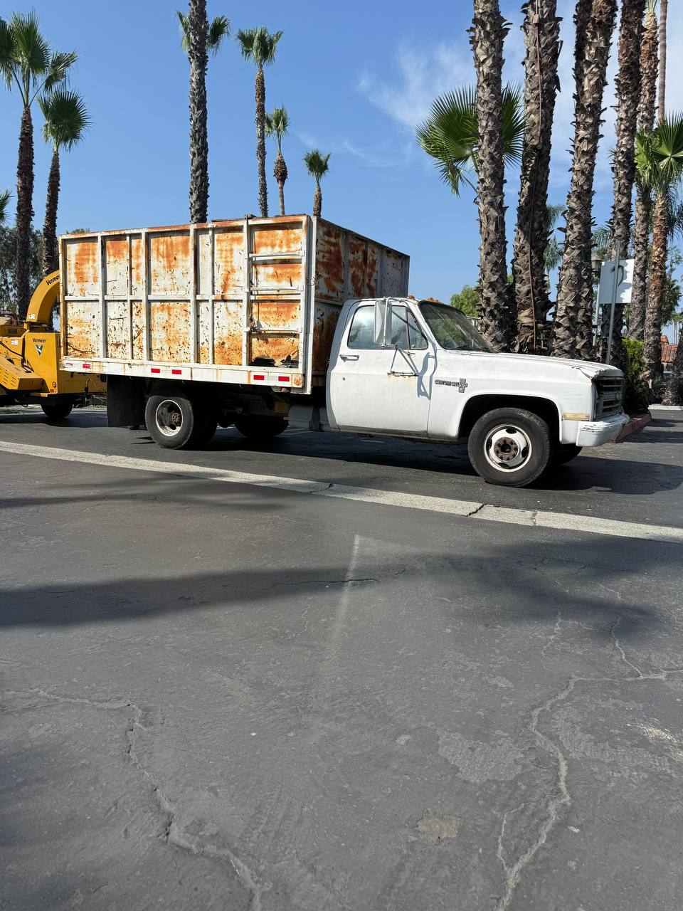 New Generation Tree Care truck and chipper on a job